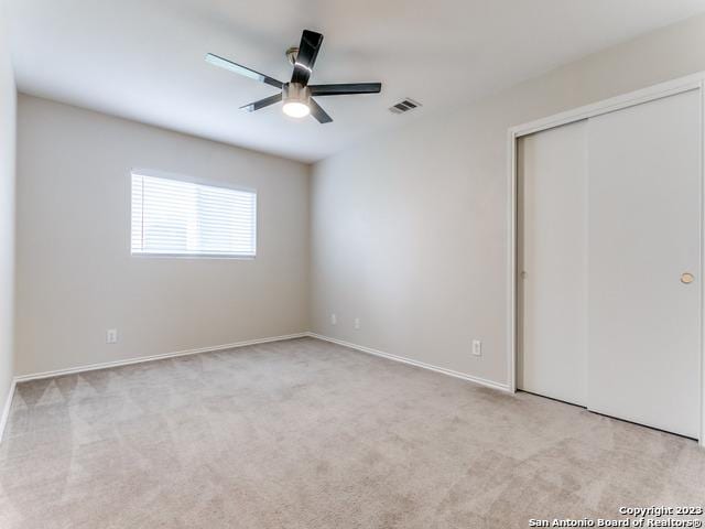 1818 Vinca Mnr, San Antonio, TX 78260 - unfurnished bedroom featuring carpet, a closet, a ceiling fan, and baseboards