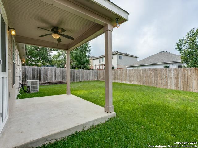 1818 Vinca Mnr, San Antonio, TX 78260 - view of yard with a ceiling fan, a patio area, and cooling unit