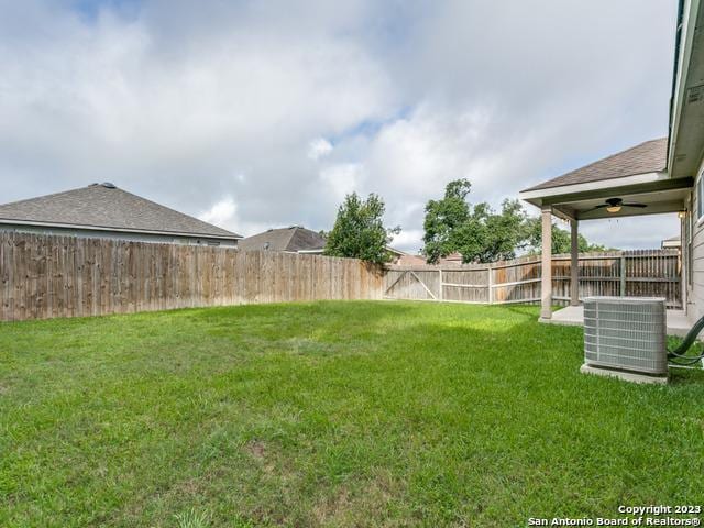 1818 Vinca Mnr, San Antonio, TX 78260 - view of yard with a ceiling fan and central AC