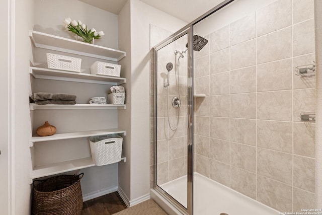 13927 Borolanite, San Antonio, TX 78253 - bathroom featuring a stall shower, wood finished floors, and baseboards