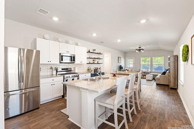 13927 Borolanite, San Antonio, TX 78253 - kitchen with stainless steel appliances, a sink, dark wood-style flooring, white cabinets, and tasteful backsplash