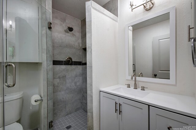 5515 Rolling Rdg, San Antonio, TX 78228 - full bathroom featuring a shower stall, vanity, and toilet