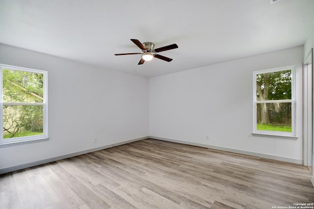 5515 Rolling Rdg, San Antonio, TX 78228 - unfurnished room with light wood-style flooring, ceiling fan, and baseboards