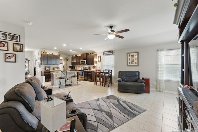 7303 Altair Loop, San Antonio, TX 78252 - living area with light tile patterned floors, ceiling fan, and baseboards