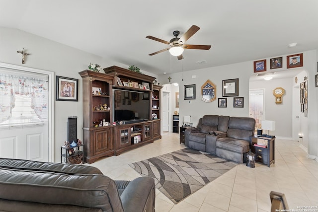 7303 Altair Loop, San Antonio, TX 78252 - living area featuring ceiling fan, light tile patterned floors, and arched walkways