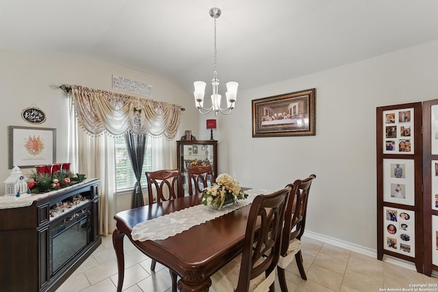 7303 Altair Loop, San Antonio, TX 78252 - dining area featuring vaulted ceiling, a chandelier, light tile patterned floors, and baseboards