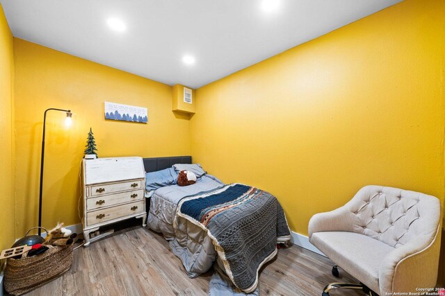 135 Fallow Dr, Kerrville, TX 78028 - bedroom with wood finished floors and recessed lighting