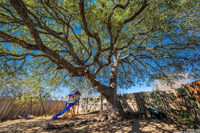 135 Fallow Dr, Kerrville, TX 78028 - fenced backyard with a playground