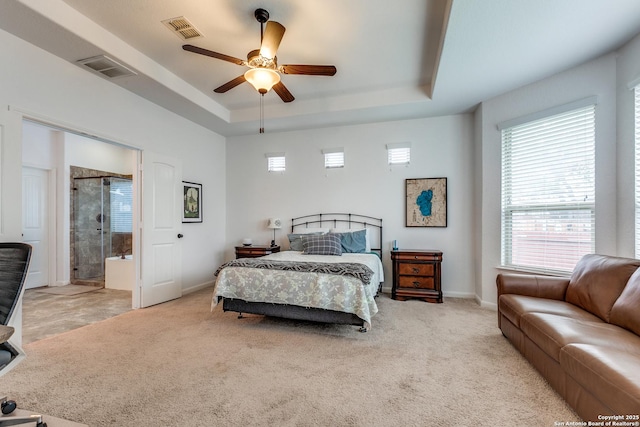 15342 Fort Marcy, San Antonio, TX 78245 - carpeted bedroom with a raised ceiling, baseboards, ensuite bath, and a ceiling fan