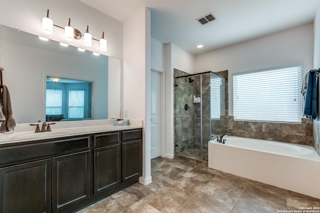 15342 Fort Marcy, San Antonio, TX 78245 - bathroom featuring a stall shower, a bath, vanity, and stone finish floors