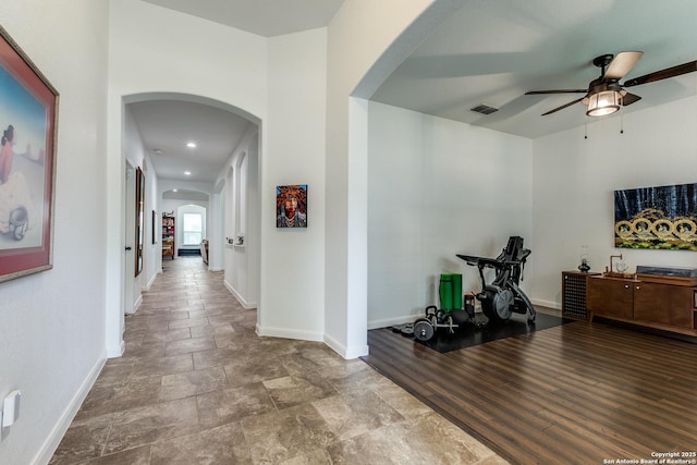 15342 Fort Marcy, San Antonio, TX 78245 - corridor with arched walkways, baseboards, and stone finish flooring
