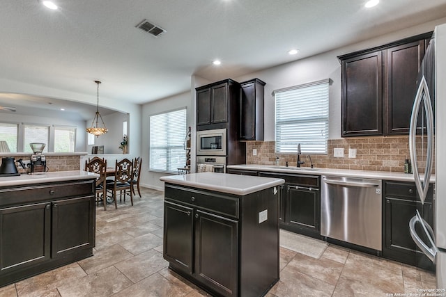 15342 Fort Marcy, San Antonio, TX 78245 - kitchen with stainless steel appliances, a sink, backsplash, plenty of natural light, and recessed lighting