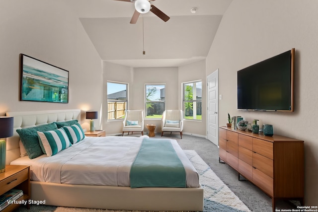 8205 Foxtail Frk, San Antonio, TX 78222 - bedroom with light colored carpet, vaulted ceiling, baseboards, and ceiling fan
