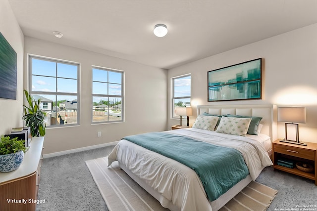 8205 Foxtail Frk, San Antonio, TX 78222 - bedroom with carpet flooring, multiple windows, and baseboards