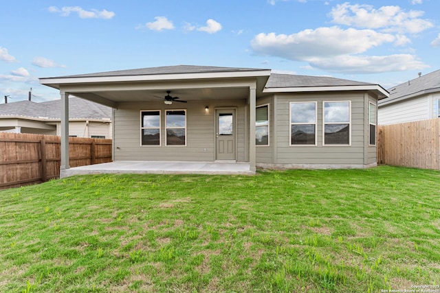 rear view of property featuring a ceiling fan and a patio