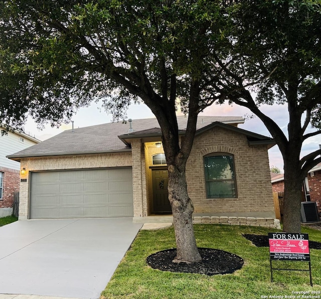 12131 Lantana Cv, San Antonio, TX 78253 - view of front of home featuring an attached garage, driveway, and brick siding