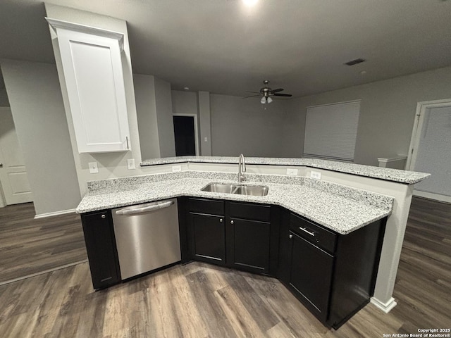12131 Lantana Cv, San Antonio, TX 78253 - kitchen featuring stainless steel dishwasher, a sink, a ceiling fan, dark wood-type flooring, and light stone countertops