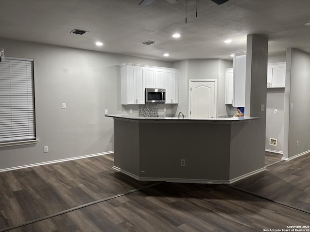 12131 Lantana Cv, San Antonio, TX 78253 - kitchen featuring stainless steel microwave, a ceiling fan, dark wood-style floors, baseboards, and recessed lighting