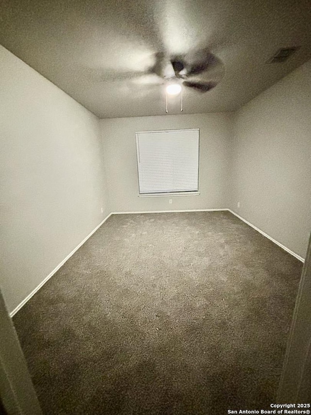 12131 Lantana Cv, San Antonio, TX 78253 - unfurnished room featuring ceiling fan, dark colored carpet, and baseboards