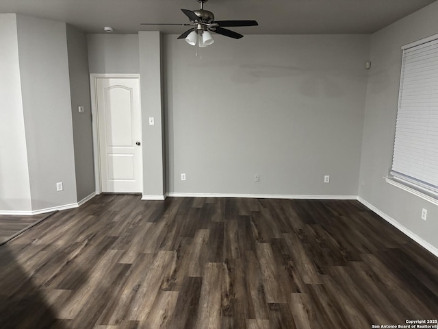 12131 Lantana Cv, San Antonio, TX 78253 - spare room featuring dark wood-type flooring, a ceiling fan, baseboards, and a smoke detector