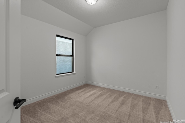 2171 Oak Run Pkwy, New Braunfels, TX 78132 - empty room with carpet, lofted ceiling, and baseboards
