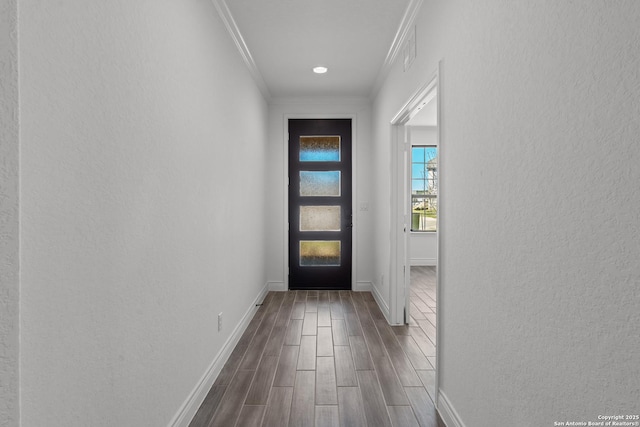 2171 Oak Run Pkwy, New Braunfels, TX 78132 - entryway with baseboards, dark wood finished floors, crown molding, and a textured wall
