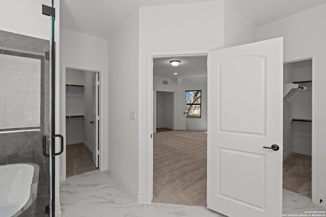2171 Oak Run Pkwy, New Braunfels, TX 78132 - full bath featuring marble finish floors, a spacious closet, a stall shower, baseboards, and a freestanding bath