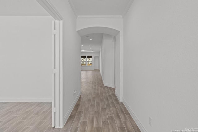 2171 Oak Run Pkwy, New Braunfels, TX 78132 - corridor with arched walkways, wood finished floors, baseboards, and ornamental molding