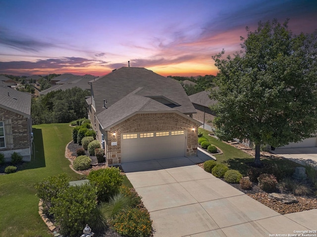 3819 Singing Water, San Antonio, TX 78253 - view of front of home featuring concrete driveway, a yard, a garage, brick siding, and roof with shingles