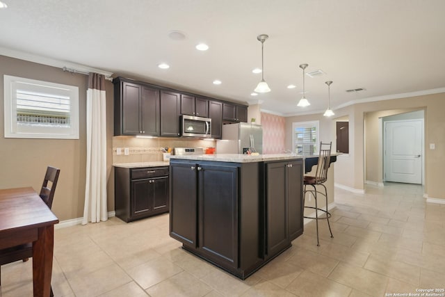 3819 Singing Water, San Antonio, TX 78253 - kitchen with stainless steel appliances, crown molding, backsplash, a kitchen breakfast bar, and a kitchen island