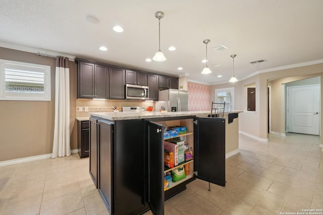 3819 Singing Water, San Antonio, TX 78253 - kitchen with stainless steel appliances, ornamental molding, a center island with sink, recessed lighting, and baseboards