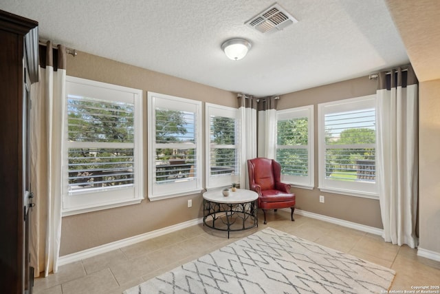 3819 Singing Water, San Antonio, TX 78253 - living area with tile patterned floors, a textured ceiling, and baseboards