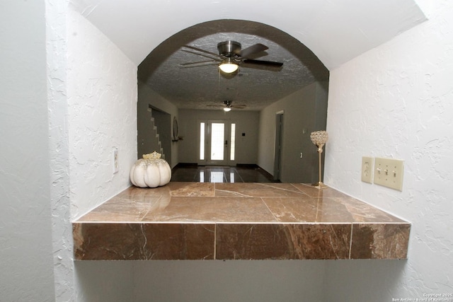 23127 Opportunity, Elmendorf, TX 78112 - corridor with a textured wall and arched walkways