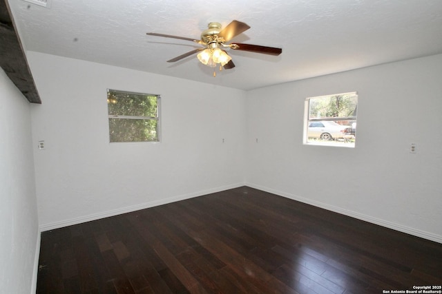 23127 Opportunity, Elmendorf, TX 78112 - unfurnished room featuring wood-type flooring, ceiling fan, and baseboards