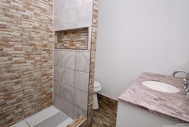 23127 Opportunity, Elmendorf, TX 78112 - full bathroom featuring vanity, a tile shower, and toilet