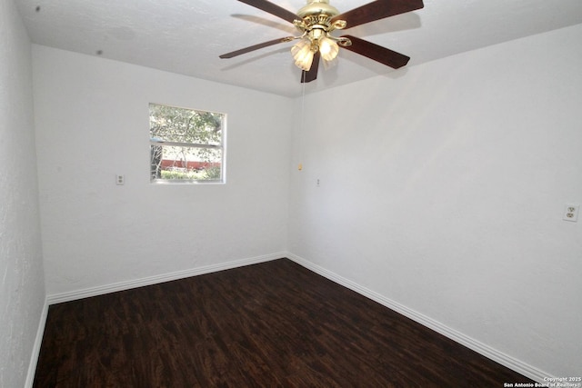 23127 Opportunity, Elmendorf, TX 78112 - spare room with dark wood-style flooring, baseboards, and ceiling fan
