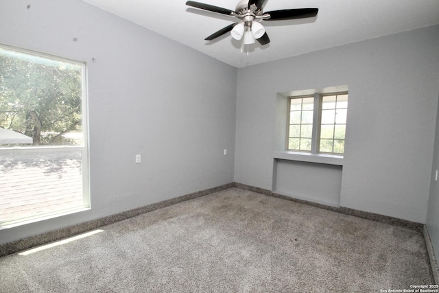 23127 Opportunity, Elmendorf, TX 78112 - carpeted empty room with healthy amount of natural light, ceiling fan, and baseboards