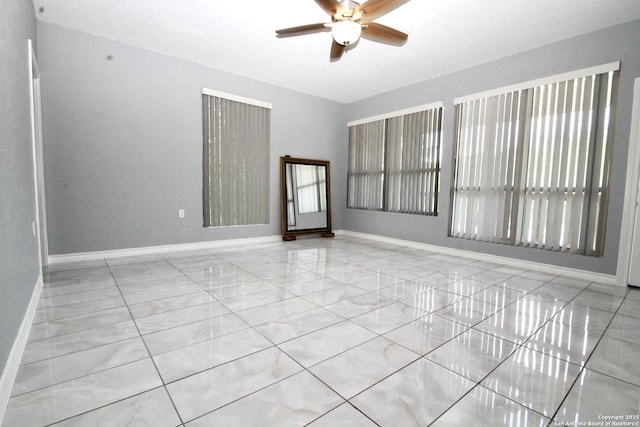 23127 Opportunity, Elmendorf, TX 78112 - empty room with a ceiling fan and baseboards