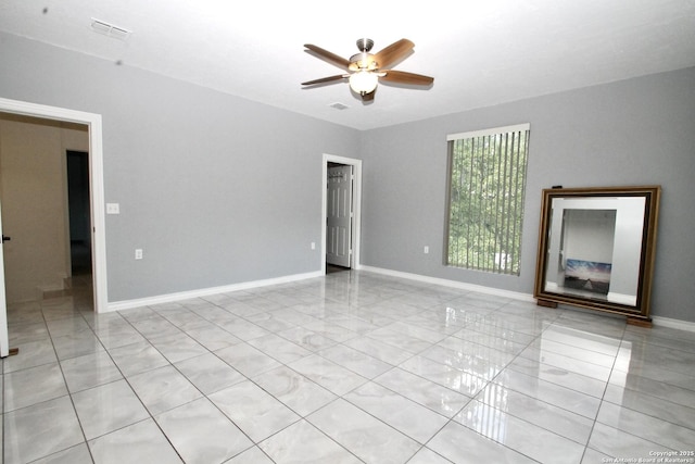 23127 Opportunity, Elmendorf, TX 78112 - spare room with ceiling fan and baseboards
