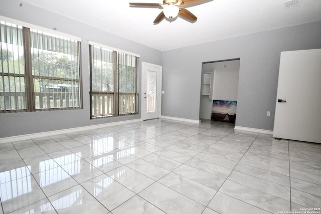 23127 Opportunity, Elmendorf, TX 78112 - empty room with ceiling fan and baseboards