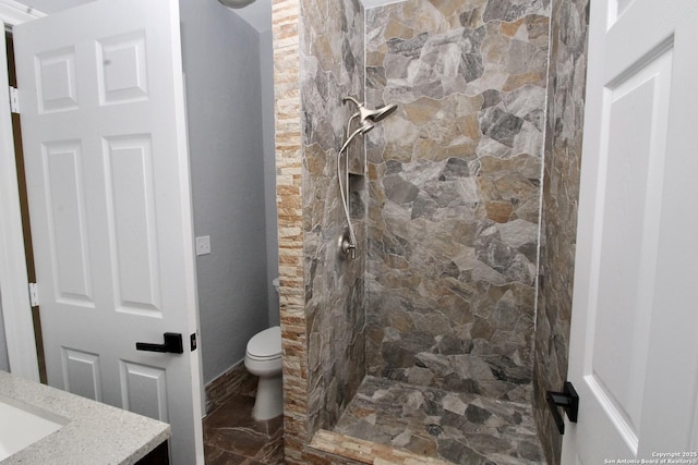 23127 Opportunity, Elmendorf, TX 78112 - bathroom with a stall shower, toilet, vanity, and baseboards