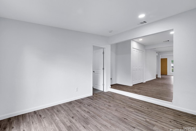 3018 Chihuahua, San Antonio, TX 78207 - unfurnished room featuring wood finished floors, baseboards, and recessed lighting