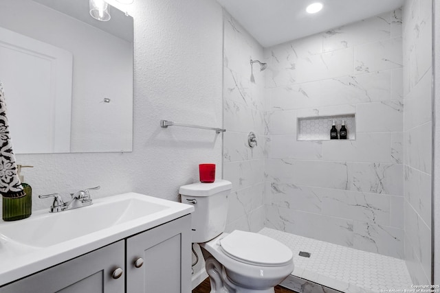 3018 Chihuahua, San Antonio, TX 78207 - bathroom featuring a tile shower, vanity, and toilet