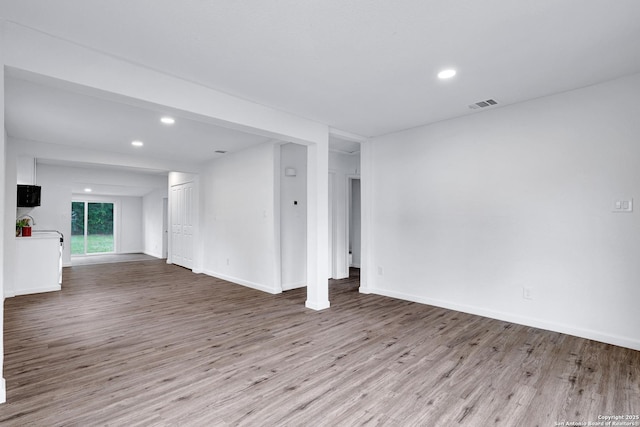 3018 Chihuahua, San Antonio, TX 78207 - unfurnished living room featuring wood finished floors, recessed lighting, and baseboards