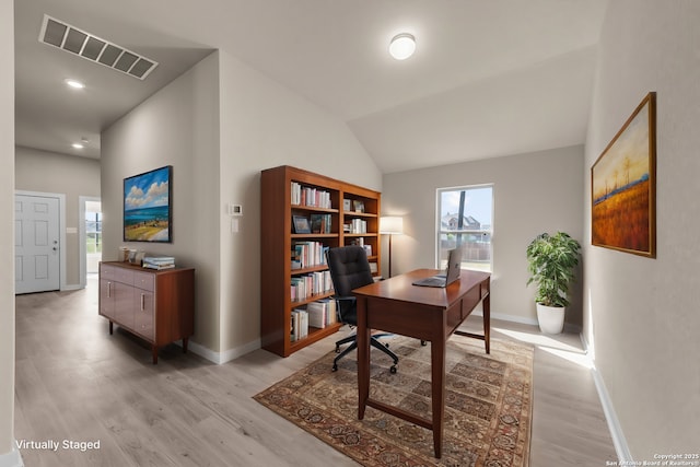 home office with light wood-style floors, baseboards, recessed lighting, and vaulted ceiling