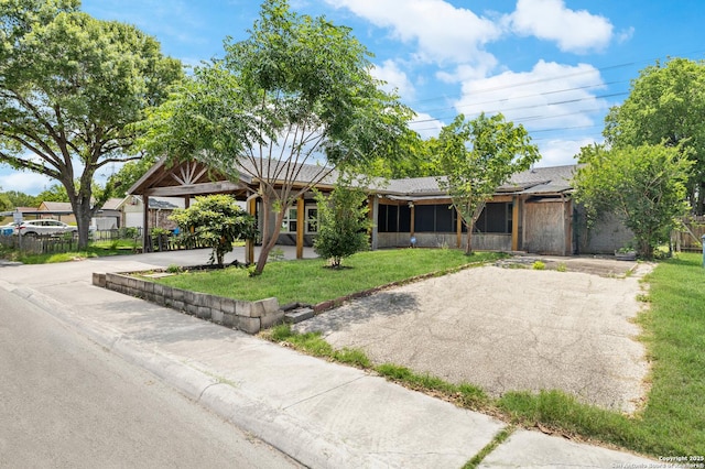 ranch-style house with asphalt driveway
