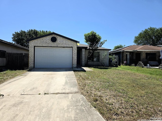 3123 Opal, San Antonio, TX 78245 - ranch-style home with driveway, brick siding, and an attached garage