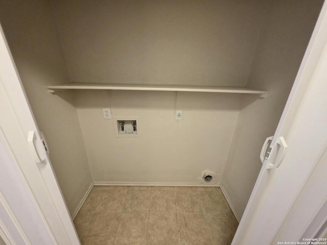 3123 Opal, San Antonio, TX 78245 - clothes washing area featuring electric dryer hookup, washer hookup, tile patterned flooring, and baseboards