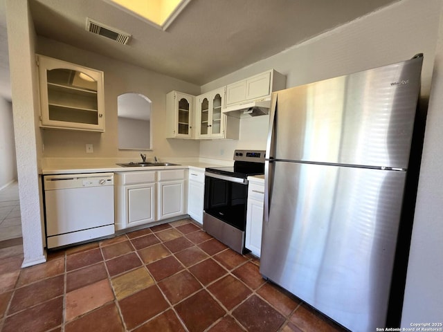 3123 Opal, San Antonio, TX 78245 - kitchen with appliances with stainless steel finishes, a sink, glass insert cabinets, light countertops, and white cabinets