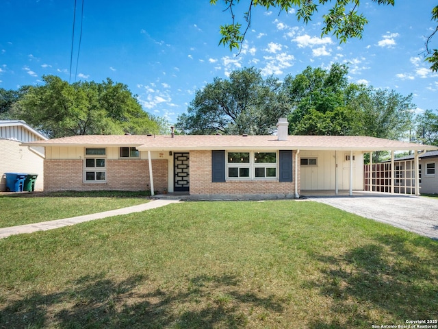 2026 E Lawndale Dr, San Antonio, TX 78209 - single story home featuring brick siding, board and batten siding, an attached carport, a front lawn, and a chimney